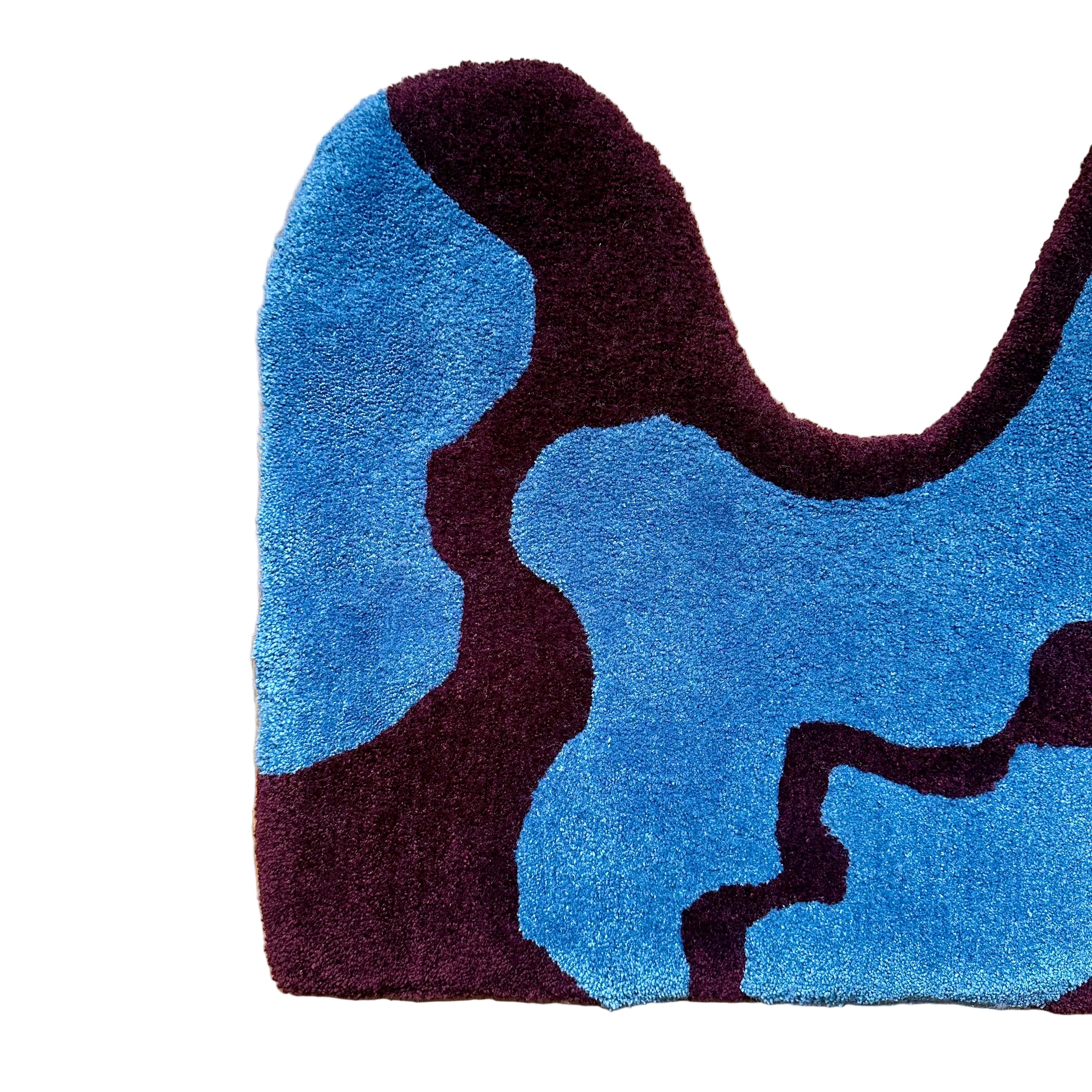 Blue and burgundy abstract rug